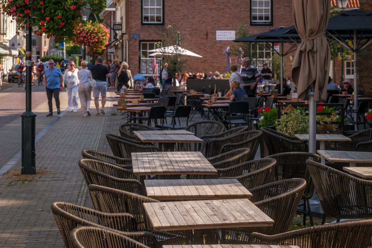 services-04 Charming outdoor cafe with stylish seating on a sunny day, perfect for a relaxing afternoon.